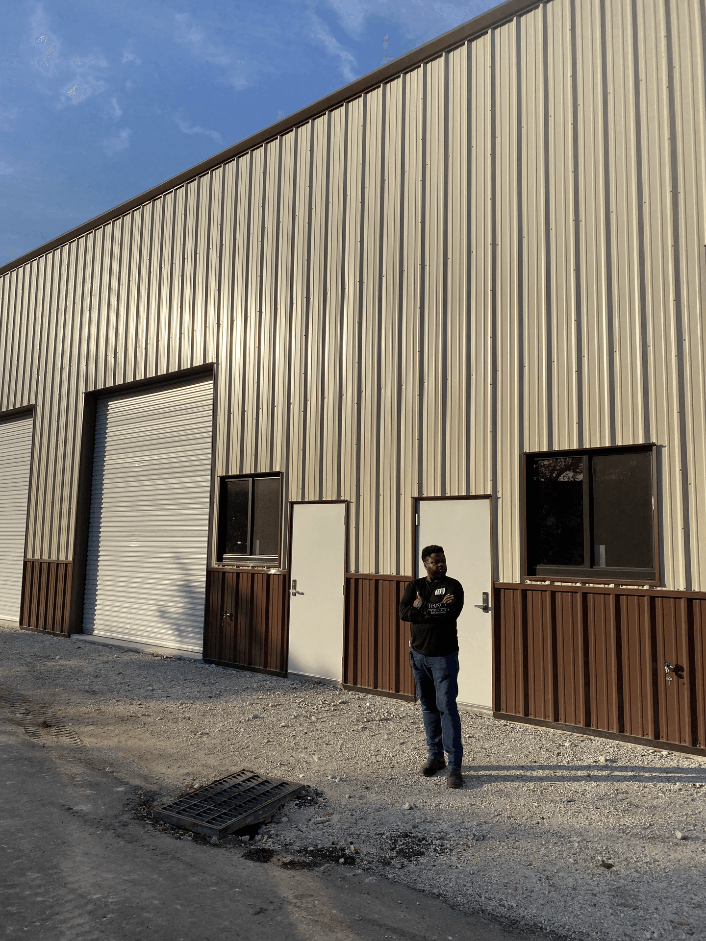 A man standing next to a building